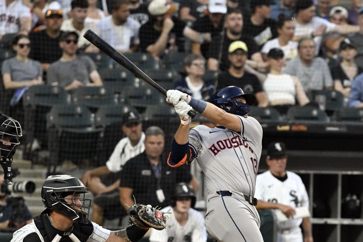 Jun 19, 2024; Chicago, Illinois, USA;  Houston Astros catcher César Salazar (18) hits an RBI single against the Chicago White Sox during the fourth inning at Guaranteed Rate Field. Mandatory Credit: Matt Marton-USA TODAY Sports