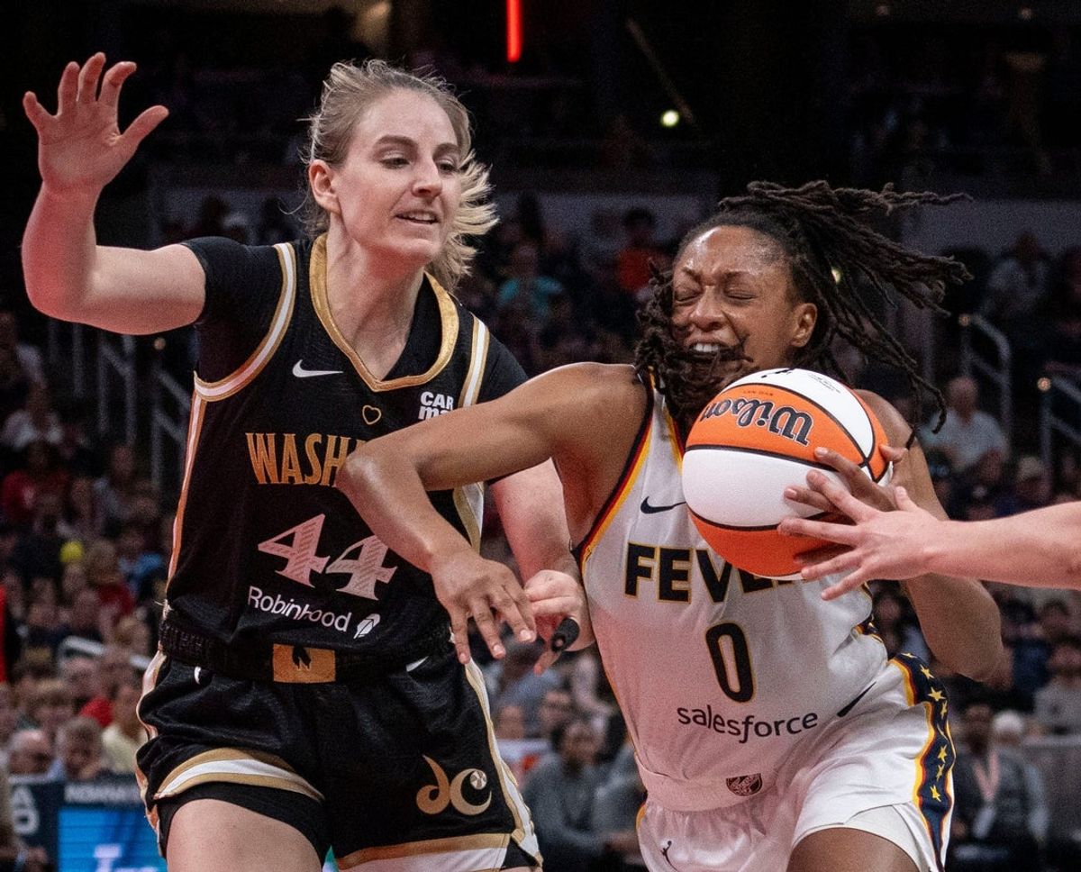 Indiana Fever guard Kelsey Mitchell (0) rushes up the court against Washington Mystics guard Karlie Samuelson (44) Wednesday, June 19, 2024, during the game at Gainbridge Fieldhouse in Indianapolis. The Indiana Fever defeated the Washington Mystics, 88 - 81.