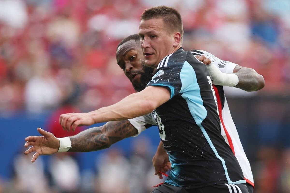 Jun 19, 2024; Frisco, Texas, USA; Minnesota United midfielder Robin Lod (17) and FC Dallas defender Sebastien Ibeagha (25) fight for the ball in the first half at Toyota Stadium. Mandatory Credit: Tim Heitman-USA TODAY Sports