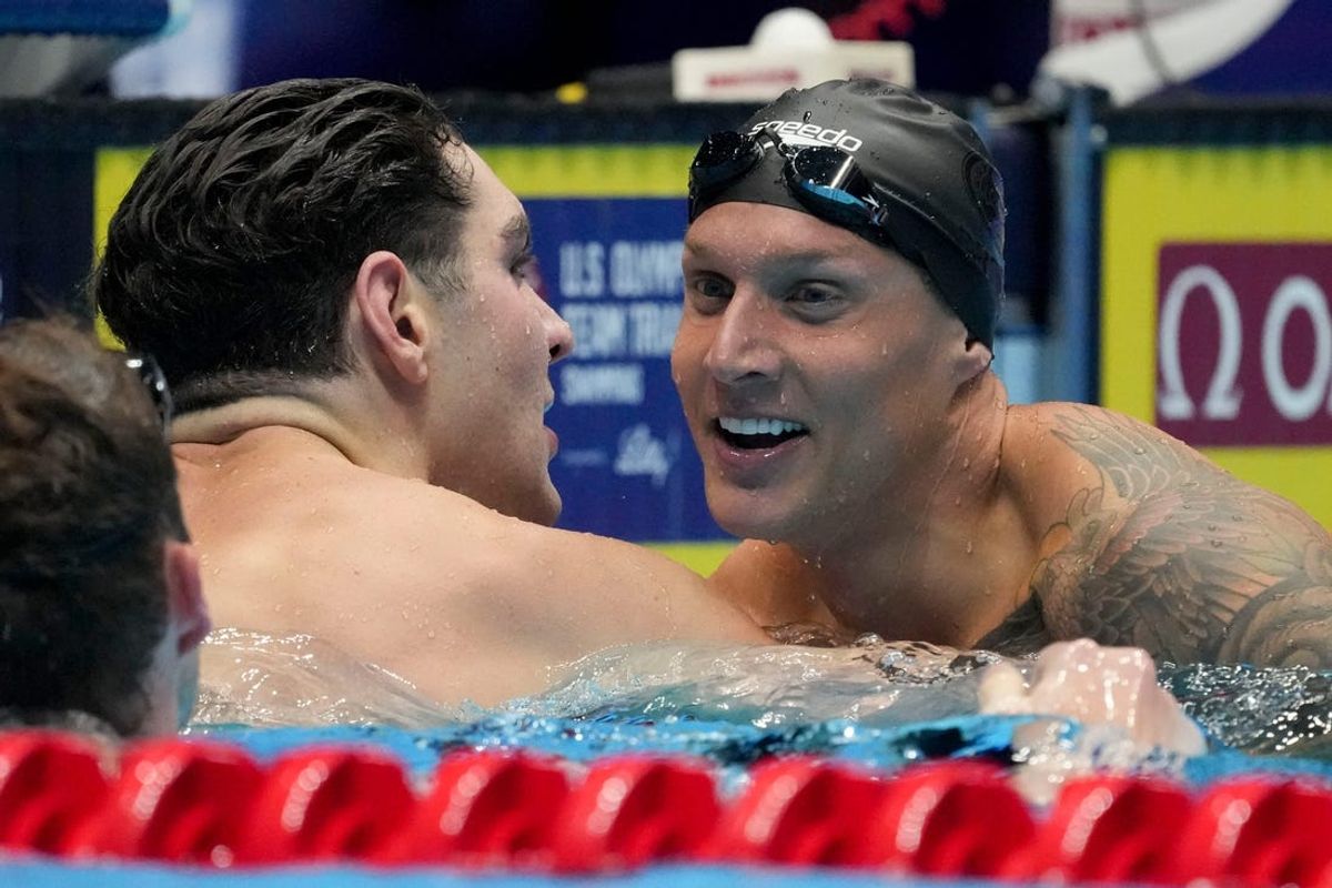 Jack Alexy (left) celebrates with Caeleb Dressel after finishing second and third in the 100-meter freestyle final Wednesday, June 19, 2024, during the fifth day of competition for the U.S. Olympic Team Swimming Trials at Lucas Oil Stadium in Indianapolis.