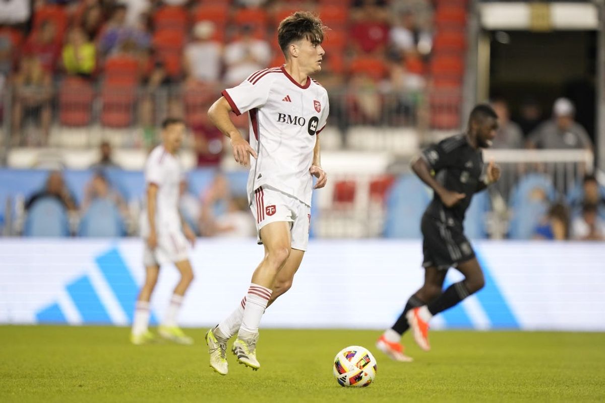 Jun 19, 2024; Toronto, Ontario, CAN; Toronto FC midfielder Alonso Coello (14) plays the ball in the second half against the Nashville SC at BMO Field. Mandatory Credit: John E. Sokolowski-USA TODAY Sports