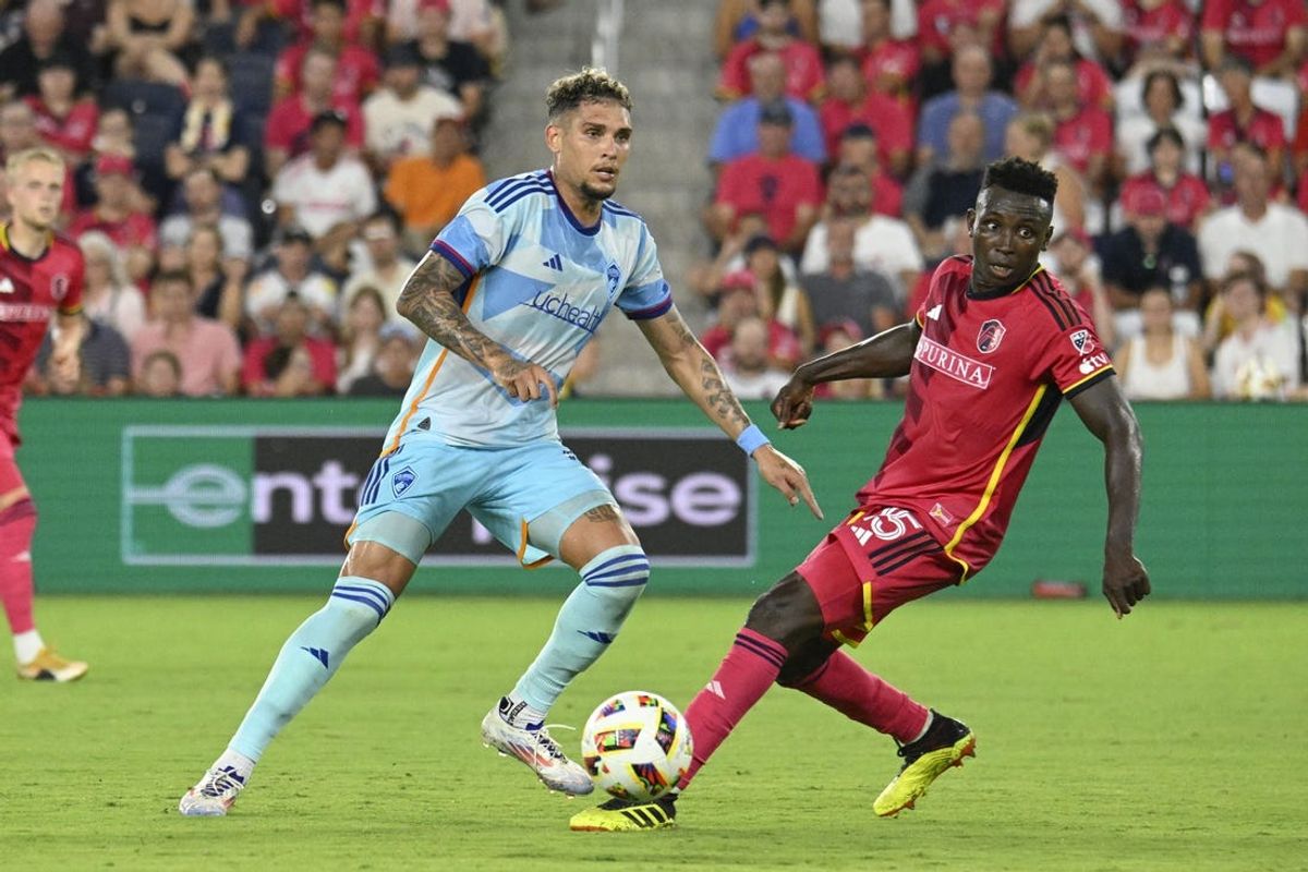 Jun 19, 2024; St. Louis, Missouri, USA; Colorado Rapids forward Rafael Navarro (9) passes the ball as St. Louis CITY SC defender Josh Yaro (15) pressures at CITYPARK. Mandatory Credit: Scott Rovak-USA TODAY Sports