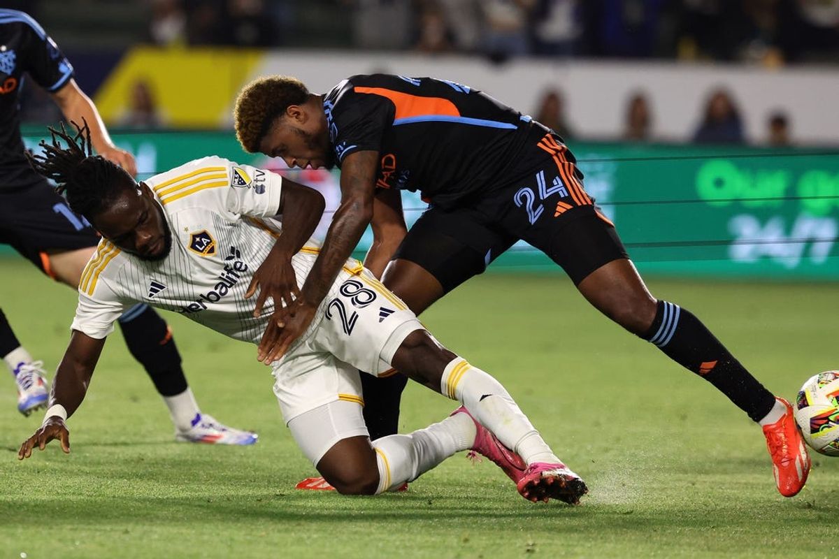 Jun 19, 2024; Carson, California, USA; New York City FC defender Tayvon Gray (24) fouls LA Galaxy forward Joseph Paintsil (28) during the second half at Dignity Health Sports Park. Mandatory Credit: Kiyoshi Mio-USA TODAY Sports