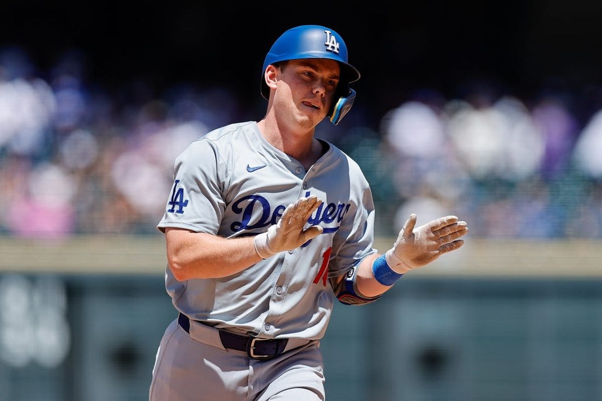 Jun 20, 2024; Denver, Colorado, USA; Los Angeles Dodgers catcher Will Smith (16) gestures as he rounds the bases on a solo home run in the fourth inning against the Colorado Rockies at Coors Field. Mandatory Credit: Isaiah J. Downing-USA TODAY Sports