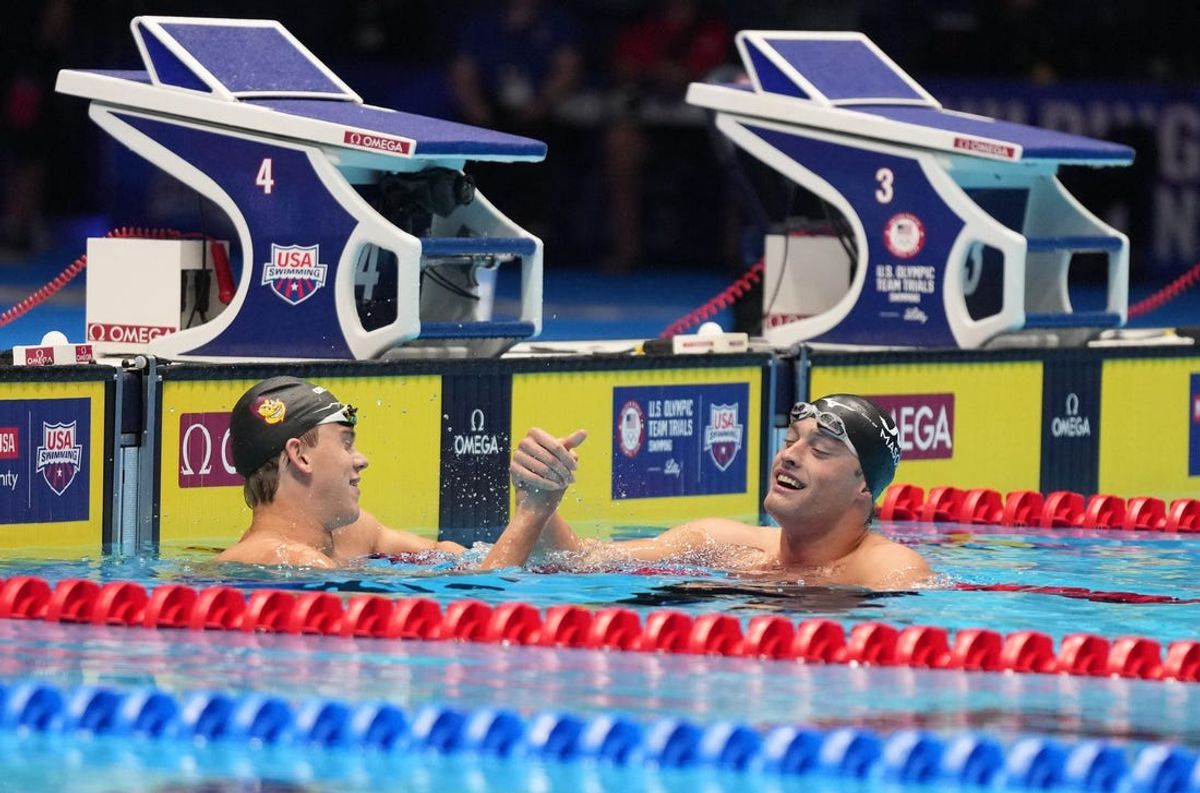 Adam Chaney and Jonny Kulow celebrate after competing in the 50-meter freestyle semifinal swim-off, Thursday, June 20, 2024, during the sixth day of the U.S. Olympic Team Swimming Trials at Lucas Oil Stadium in Indianapolis