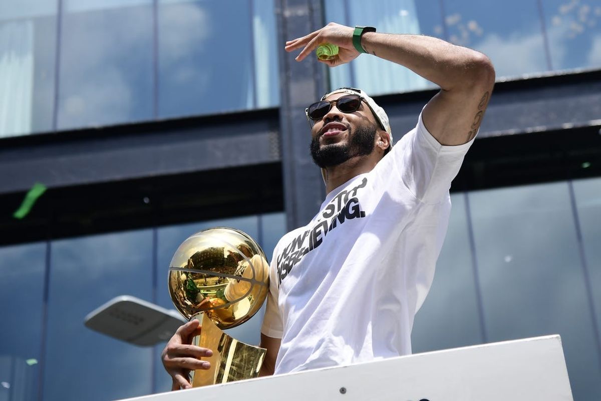 Jun 21, 2024; Boston, MA, USA;  Boston Celtics player Jayson Tatum on a duck boat during the Boston Celtics championship parade. Mandatory Credit: Bob DeChiara-USA TODAY Sports
