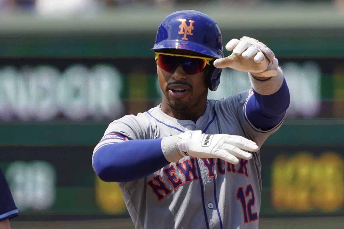 Jun 21, 2024; Chicago, Illinois, USA; New York Mets shortstop Francisco Lindor (12) gestures after hitting a double against the Chicago Cubs during the fourth inning at Wrigley Field. Mandatory Credit: David Banks-USA TODAY Sports