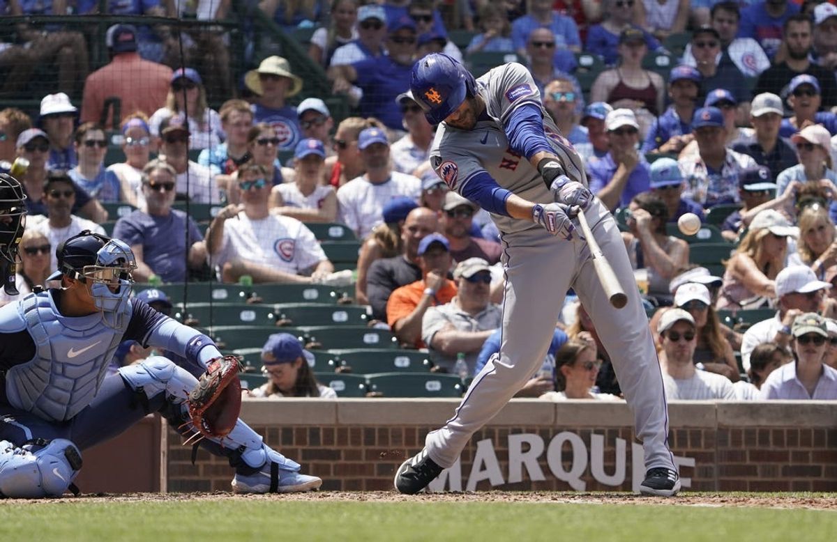 Jun 21, 2024; Chicago, Illinois, USA; New York Mets designated hitter J.D. Martinez (28) hits a one run single against the Chicago Cubs during the fourth inning at Wrigley Field. Mandatory Credit: David Banks-USA TODAY Sports