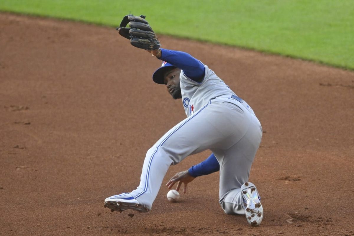 Jun 21, 2024; Cleveland, Ohio, USA; Toronto Blue Jays second baseman Orelvis Martinez (13) commits a fielding error in the second inning against the Cleveland Guardians at Progressive Field. Mandatory Credit: David Richard-USA TODAY Sports