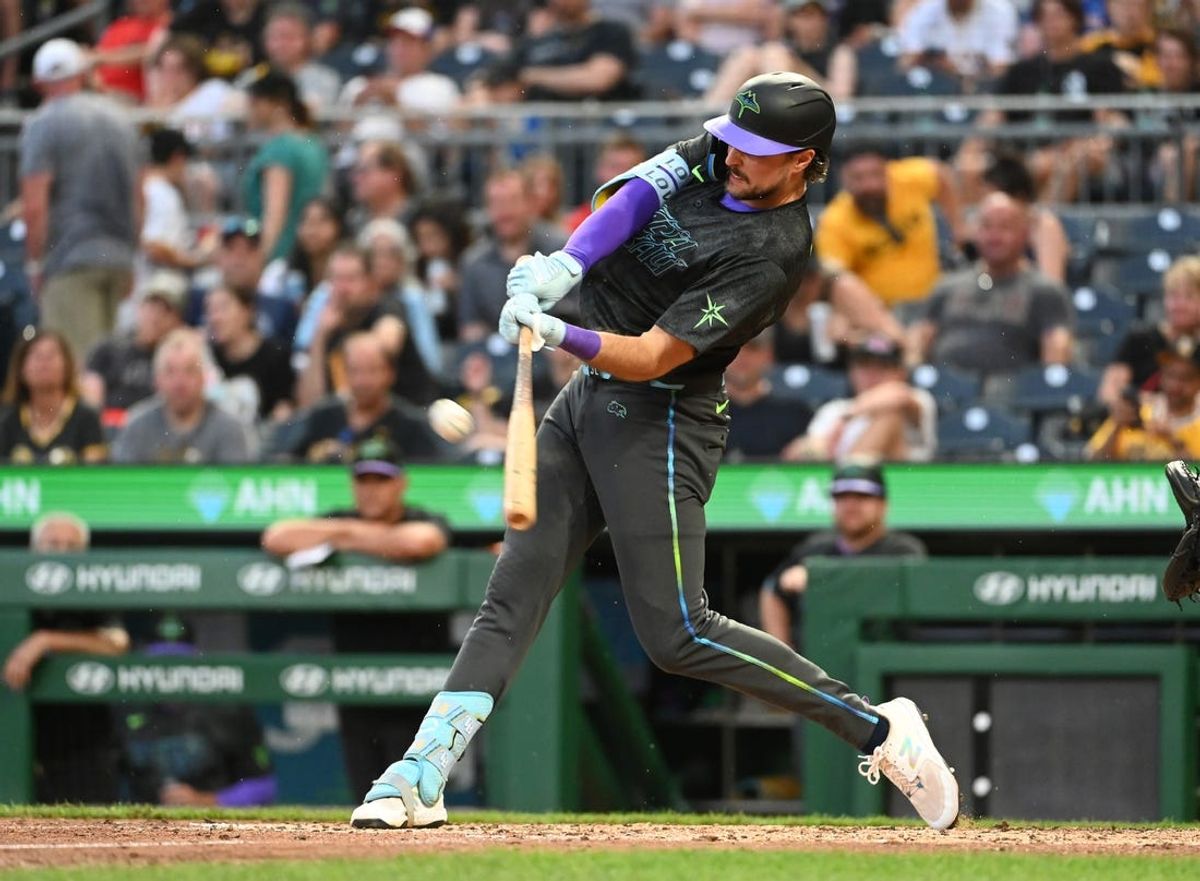 Jun 21, 2024; Pittsburgh, Pennsylvania, USA; Tampa Bay Rays batter Josh Lowe hits a home run against the Pittsburgh Pirates during the sixth inning at PNC Park. Mandatory Credit: Philip G. Pavely-USA TODAY Sports