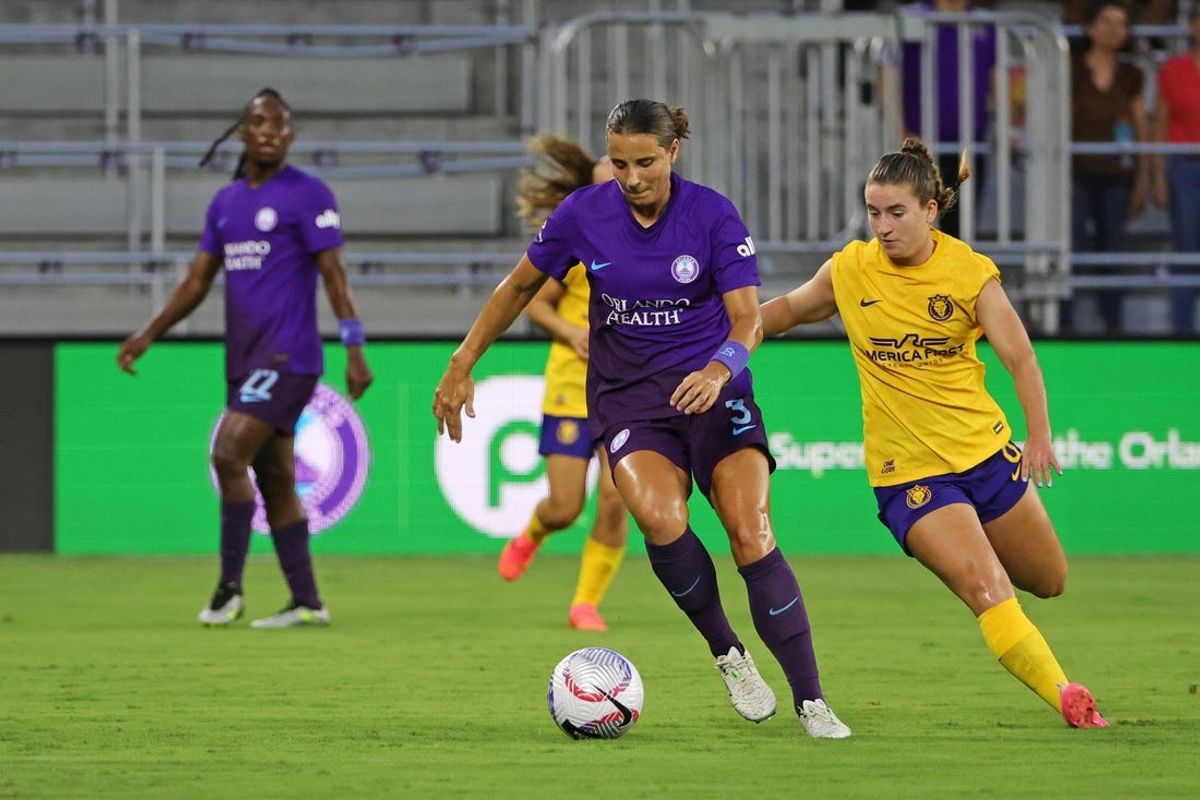 Jun 21, 2024; Orlando, Florida, USA; Orlando Pride defender Kylie Strom (3) and Utah Royals FC forward Ally Sentnor (9) race for the ball during the first half at Inter&Co Stadium. Mandatory Credit: Mike Watters-USA TODAY Sports