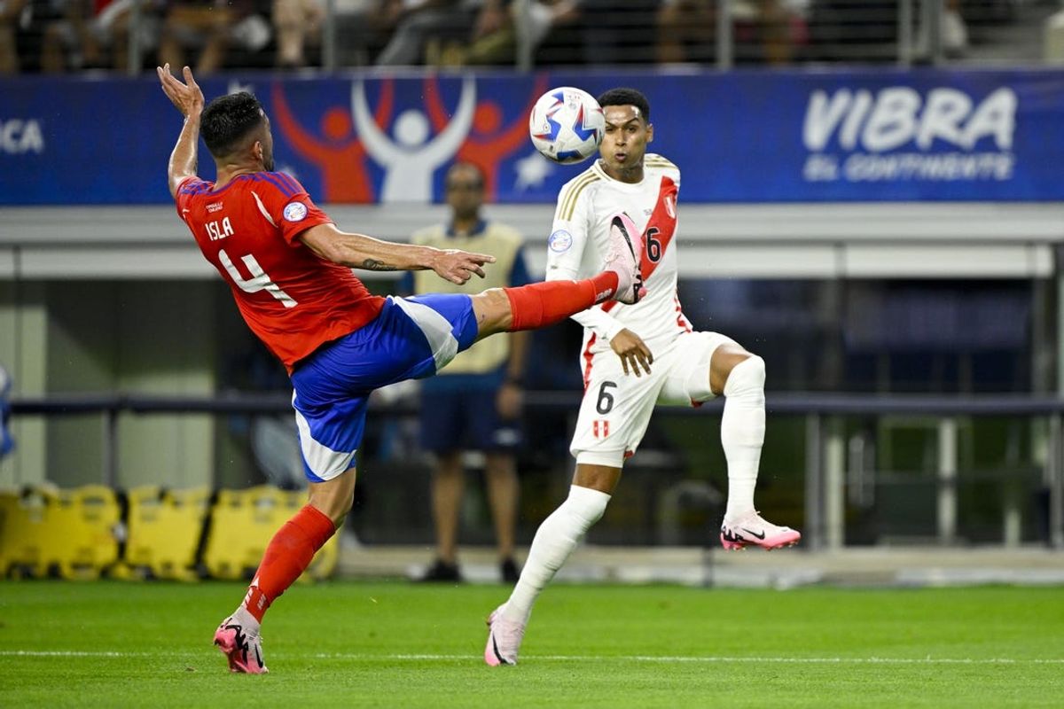 Jun 21, 2024; Arlington, TX, USA; Chile defender Mauricio Isla (4) kicks the ball away from Peru defender Marcos Lopez (6) during the first half in a 2024 Copa America match at AT&T Stadium. Mandatory Credit: Jerome Miron-USA TODAY Sports