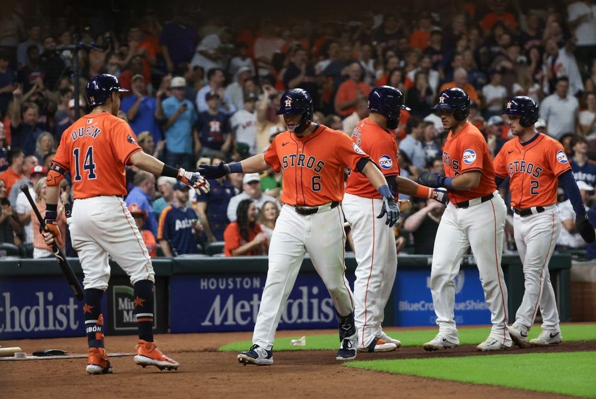 Jun 21, 2024; Houston, Texas, USA; Houston Astros shortstop Mauricio Dubon (14) celebrates center fielder Jake Meyers (6) three run home run against the Baltimore Orioles in the fifth inning at Minute Maid Park. Mandatory Credit: Thomas Shea-USA TODAY Sports