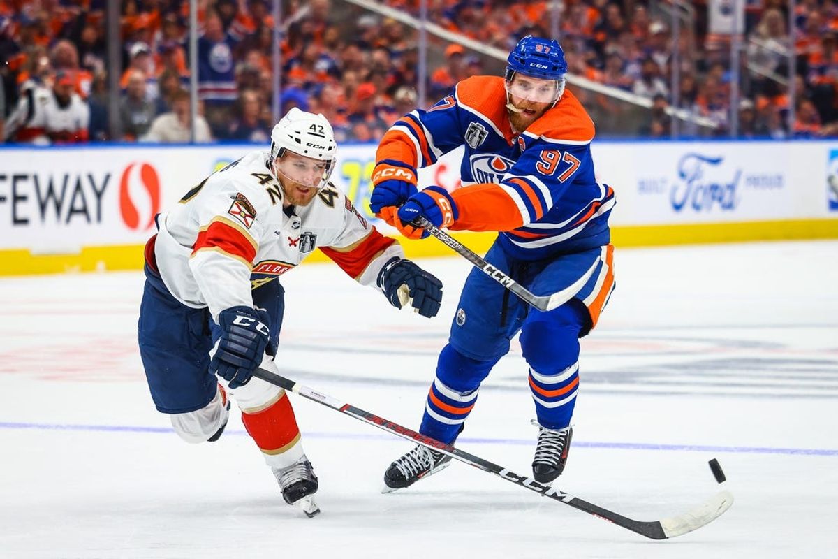 Jun 21, 2024; Edmonton, Alberta, CAN; Florida Panthers defenseman Gustav Forsling (42) and Edmonton Oilers center Connor McDavid (97) battles for the puck during the second period in game six of the 2024 Stanley Cup Final at Rogers Place. Mandatory Credit: Sergei Belski-USA TODAY Sports