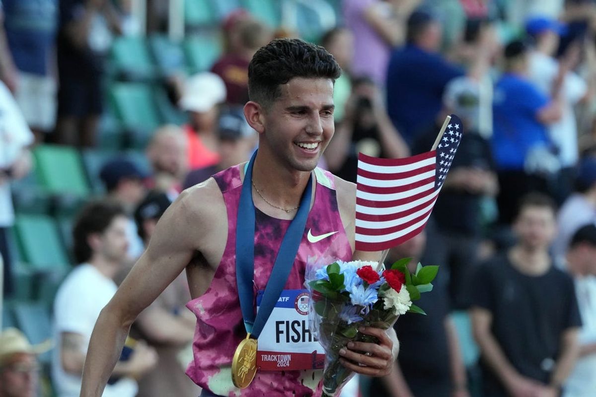 Jun 21, 2024; Eugene, OR, USA; Grant Fisher takes a victory lap after winning the 10,000m in 27:49.47 during the US Olympic Team Trials at Hayward Field. Mandatory Credit: Kirby Lee-USA TODAY Sports