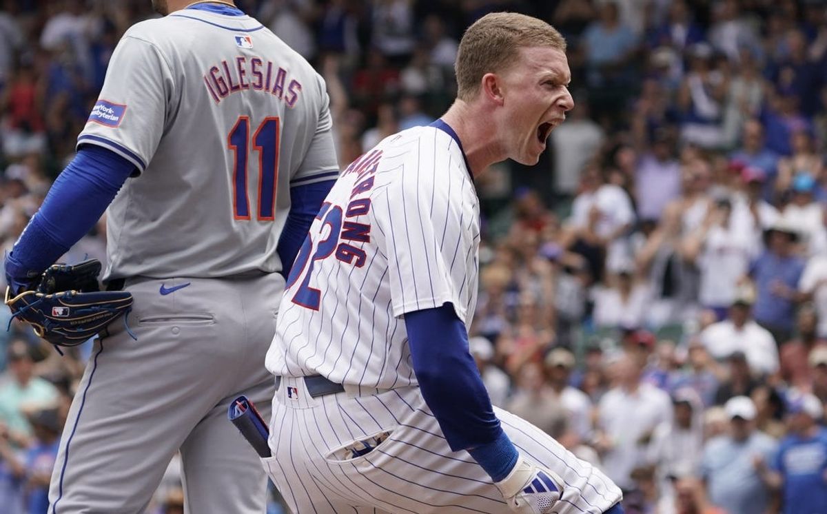 Jun 22, 2024; Chicago, Illinois, USA; Chicago Cubs outfielder Pete Crow-Armstrong (52) reacts after hitting an RBI triple against the New York Mets during the first inning at Wrigley Field. Mandatory Credit: David Banks-USA TODAY Sports