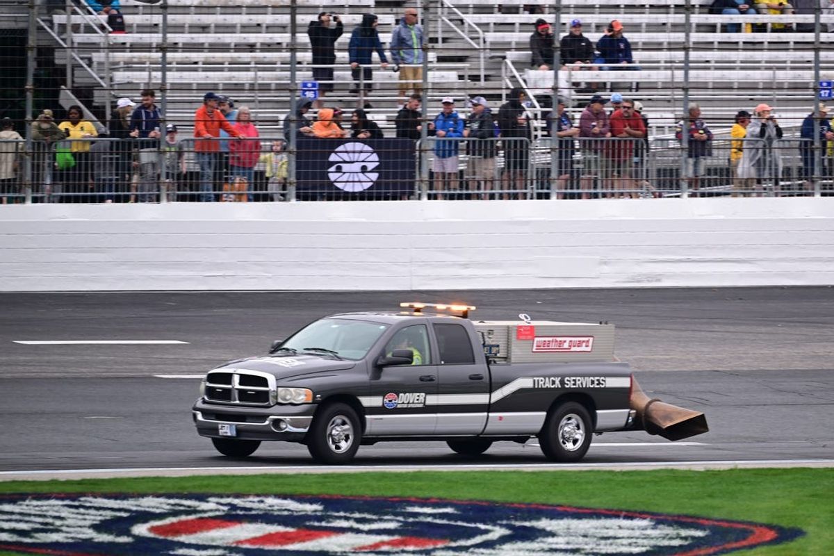 Jun 22, 2024; Loudon, New Hampshire, USA; Crews dry the track before the start of the SciAps 200 at New Hampshire Motor Speedway. Mandatory Credit: Eric Canha-USA TODAY Sports