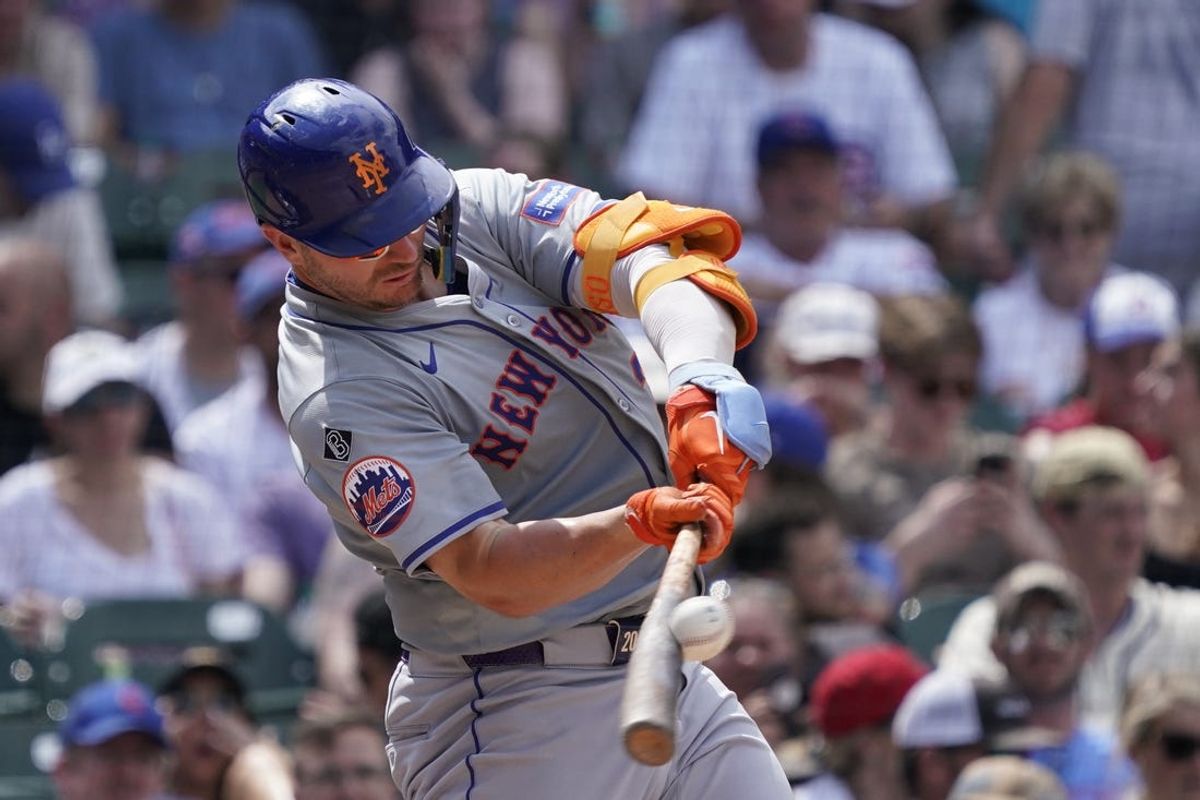 Jun 22, 2024; Chicago, Illinois, USA; New York Mets first baseman Pete Alonso (20) hits a single against the Chicago Cubs during the sixth inning at Wrigley Field. Mandatory Credit: David Banks-USA TODAY Sports