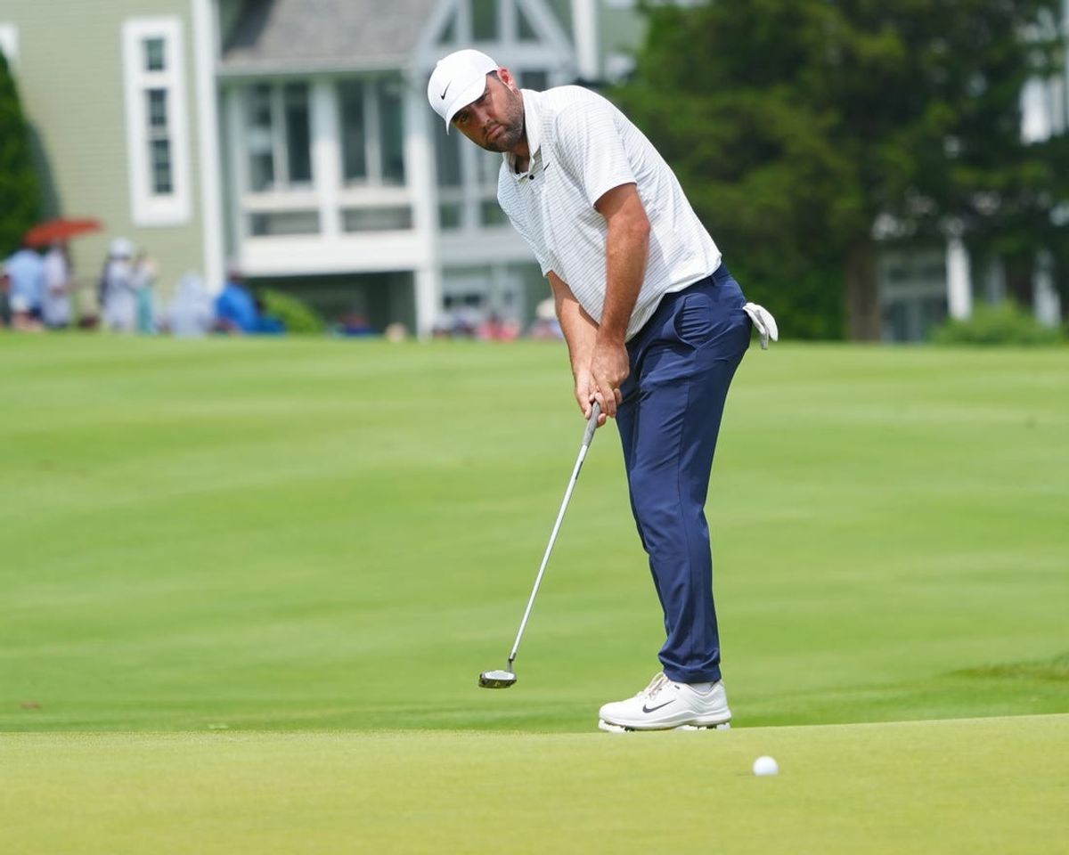 Jun 22, 2024; Cromwell, Connecticut, USA; Scottie Scheffler sinks a putt on the second hole during the third round of the Travelers Championship golf tournament at TPC River Highlands. Mandatory Credit: Gregory Fisher-USA TODAY Sports