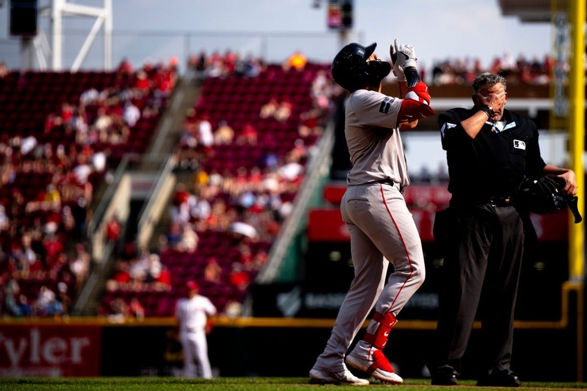 Boston Red Sox first baseman Dominic Smith (2) crosse home plate after hitting a solo home run in the fifth inning of the MLB baseball game between the Cincinnati Reds and the Boston Red Sox at Great American Ball Park in Cincinnati on Saturday, June 22, 2024.