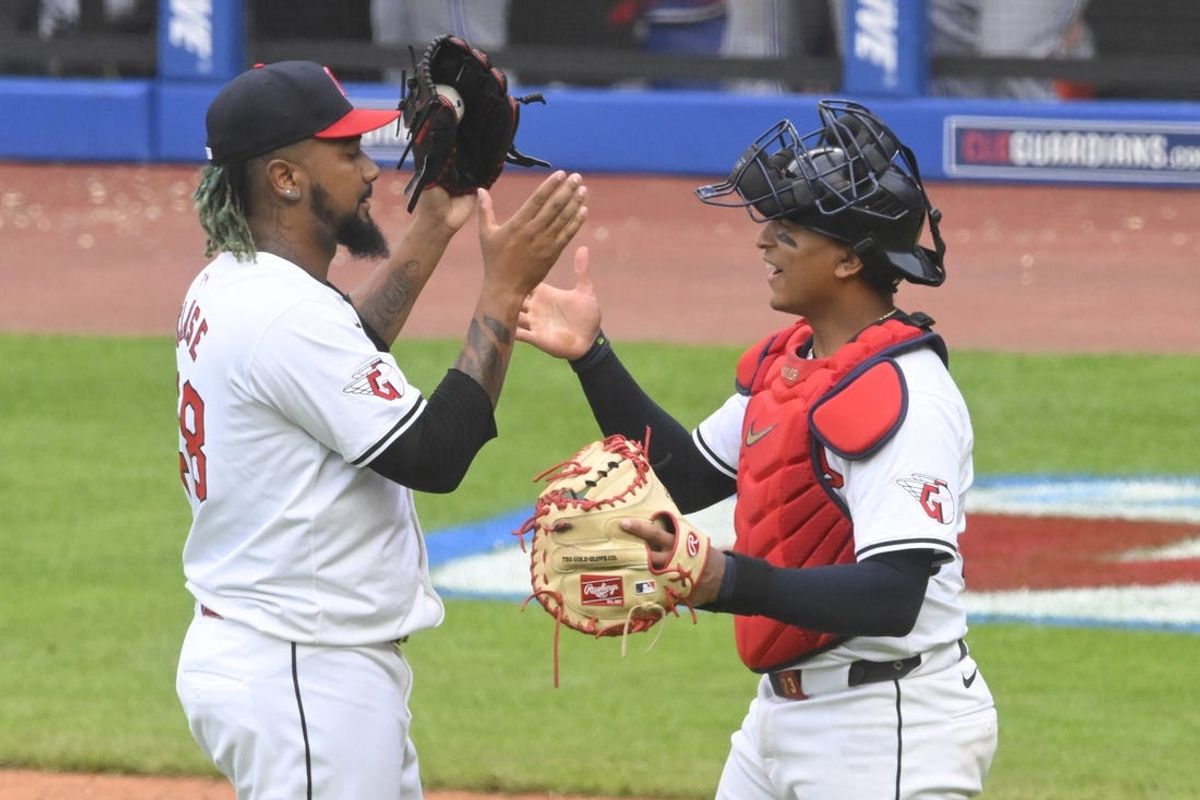 Jun 22, 2024; Cleveland, Ohio, USA; Cleveland Guardians relief pitcher Emmanuel Clase (48) and catcher Bo Naylor (23) celebrate after defeating the Toronto Blue Jays at Progressive Field. Mandatory Credit: David Richard-USA TODAY Sports