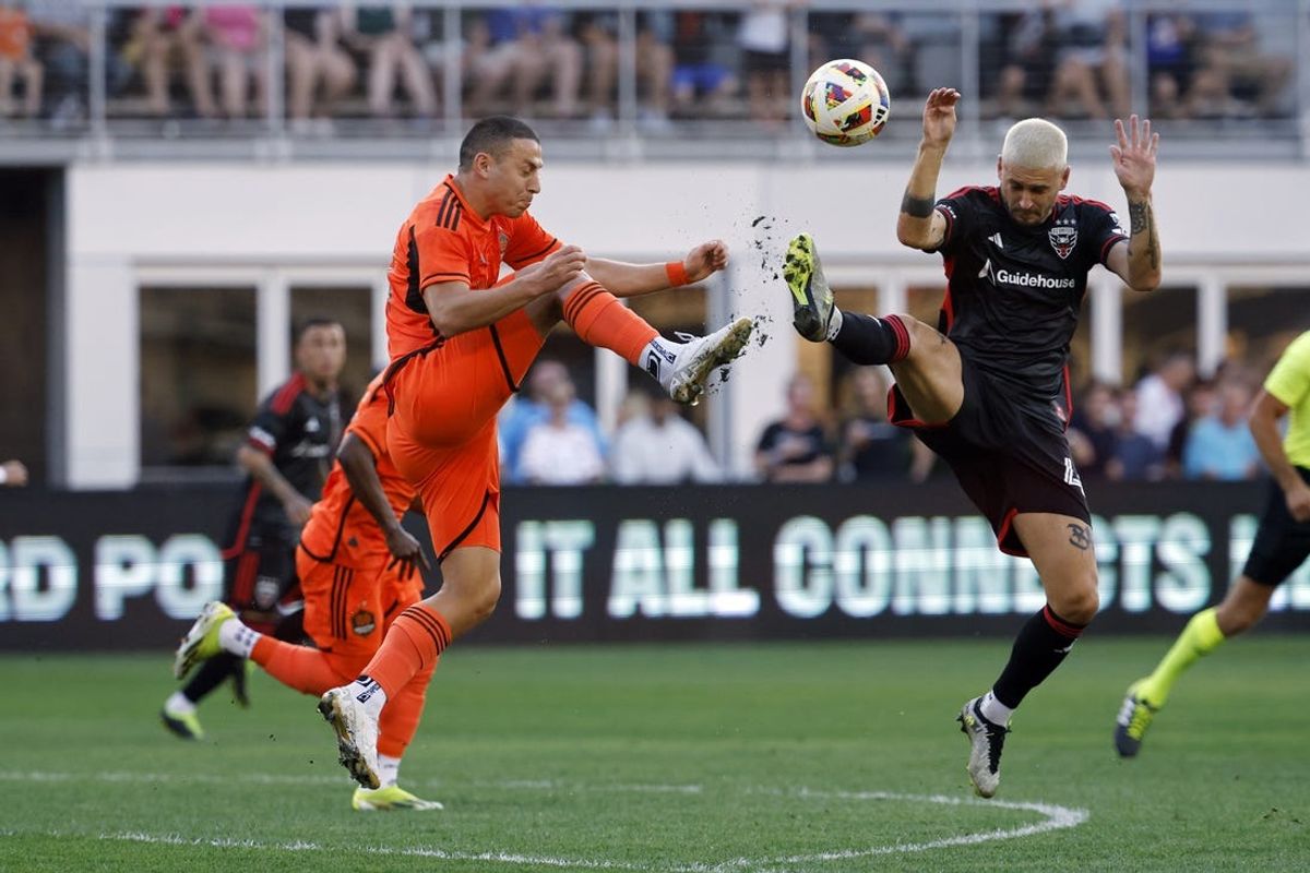Jun 22, 2024; Washington, District of Columbia, USA; Houston Dynamo forward Sebastian Ferreira (11) and D.C. United midfielder Mateusz Klich (43) battle for the ball in the first half at Audi Field. Mandatory Credit: Geoff Burke-USA TODAY Sports