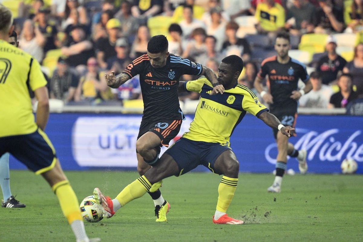 Jun 22, 2024; Nashville, Tennessee, USA; New York City FC forward Santiago Rodriguez (10) and Nashville SC midfielder Dru Yearwood (16) battle for the ball in the first half at Geodis Park. Mandatory Credit: Steve Roberts-USA TODAY Sports