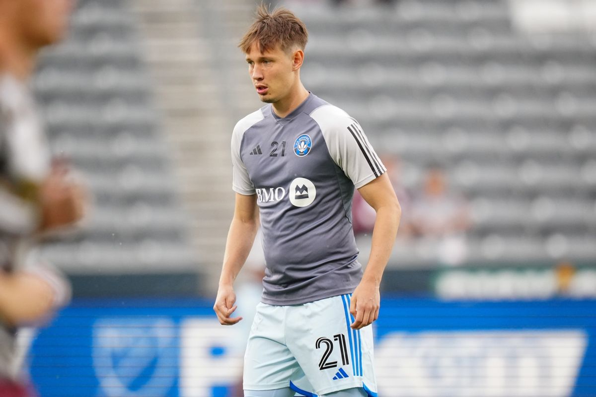 Jun 22, 2024; Commerce City, Colorado, USA; CF Montreal midfielder Lassi Lappalainen (21) warms up before the game against the Colorado Rapids at Dick's Sporting Goods Park. Mandatory Credit: Ron Chenoy-Imagn Images