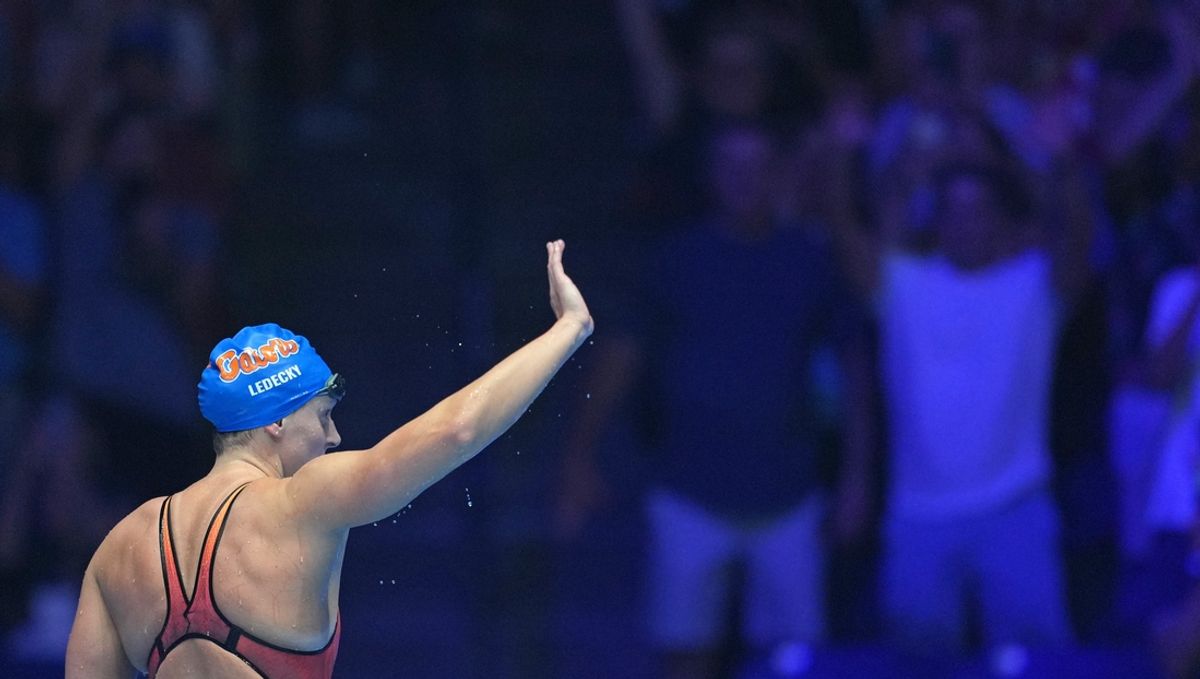 Katie Ledecky waves to the crowd after the 800-meter freestyle final, Saturday, June 22, 2024, during the eighth day of the U.S. Olympic Team Swimming Trials at Lucas Oil Stadium in Indianapolis.