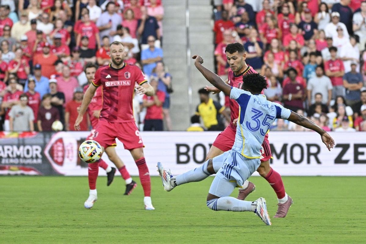 Jun 22, 2024; St. Louis, Missouri, USA; Atlanta United midfielder Ajani Fortune (35) passes the ball against St. Louis CITY SC during the first half at CITYPARK. Mandatory Credit: Jeff Le-USA TODAY Sports