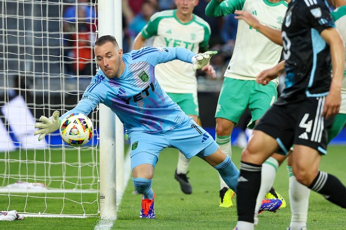 Jun 22, 2024; Saint Paul, Minnesota, USA; Austin FC goalkeeper Brad Stuver (1) keeps the ball in play against Minnesota United during the first half at Allianz Field. Mandatory Credit: Matt Krohn-USA TODAY Sports