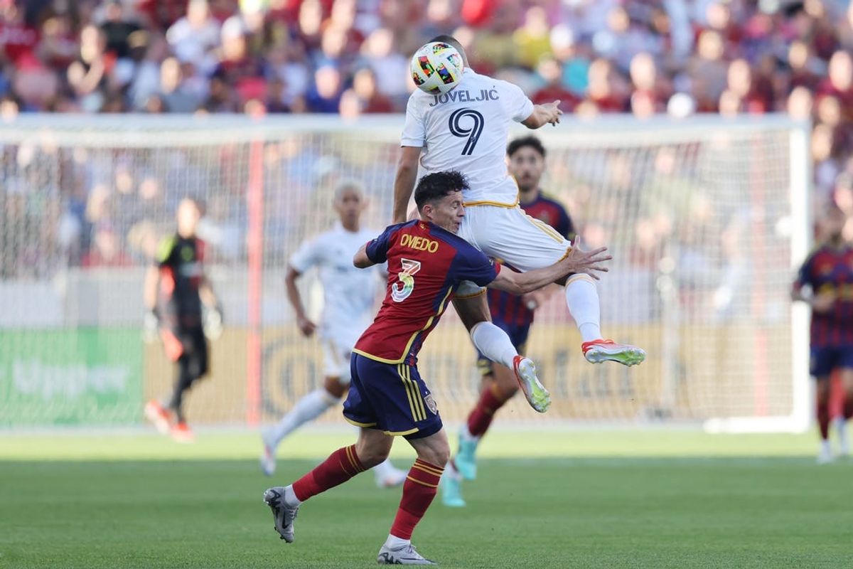 Jun 22, 2024; Sandy, Utah, USA; Real Salt Lake defender Bryan Oviedo (3) and LA Galaxy forward Dejan Joveljic (9) collide in the first half at America First Field. Mandatory Credit: Rob Gray-USA TODAY Sports