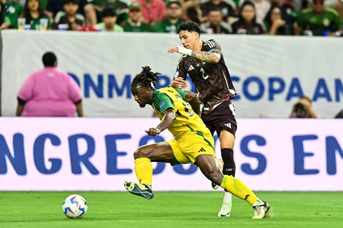 Jun 22, 2024; Houston, TX, USA; Jamaica defender Gregory Leigh (22) and Mexico defender Israel Reyes (2) battles for the ball during the first half at NRG Stadium. Mandatory Credit: Maria Lysaker-USA TODAY Sports