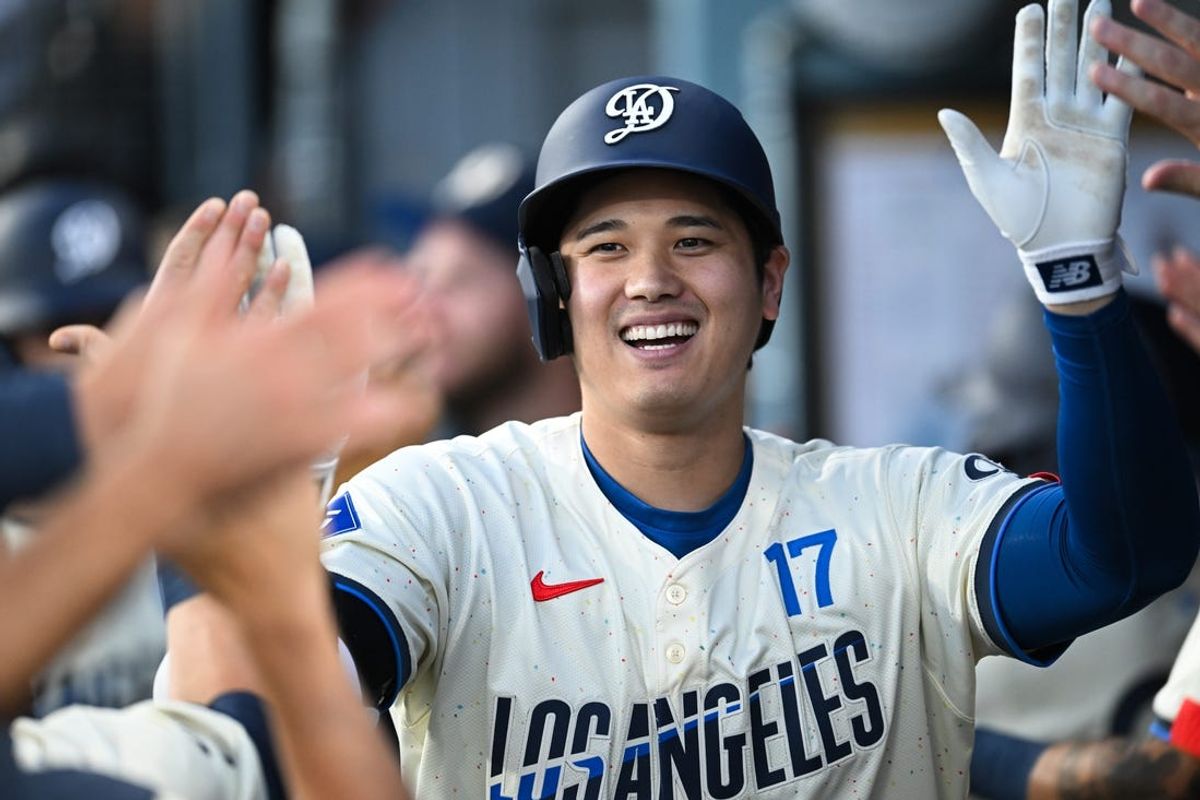 Jun 22, 2024; Los Angeles, California, USA; Los Angeles Dodgers designated hitter Shohei Ohtani (17) celebrates with teammates after hitting a home run against the Los Angeles Angels during the third inning at Dodger Stadium. Mandatory Credit: Jonathan Hui-USA TODAY Sports