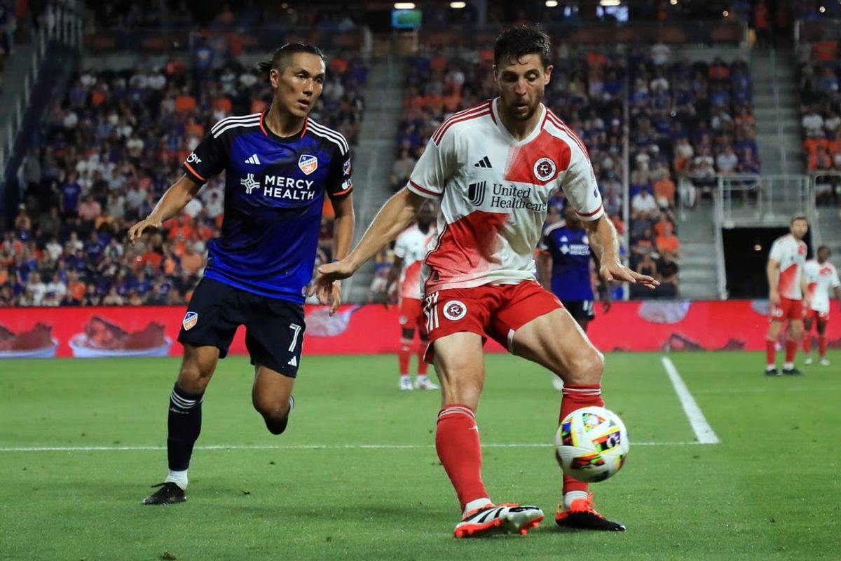 Jun 22, 2024; Cincinnati, Ohio, USA; New England Revolution midfielder Matthew Polster (8) controls the ball against FC Cincinnati forward Yuya Kubo (7) in the second half at TQL Stadium. Mandatory Credit: Katie Stratman-USA TODAY Sports