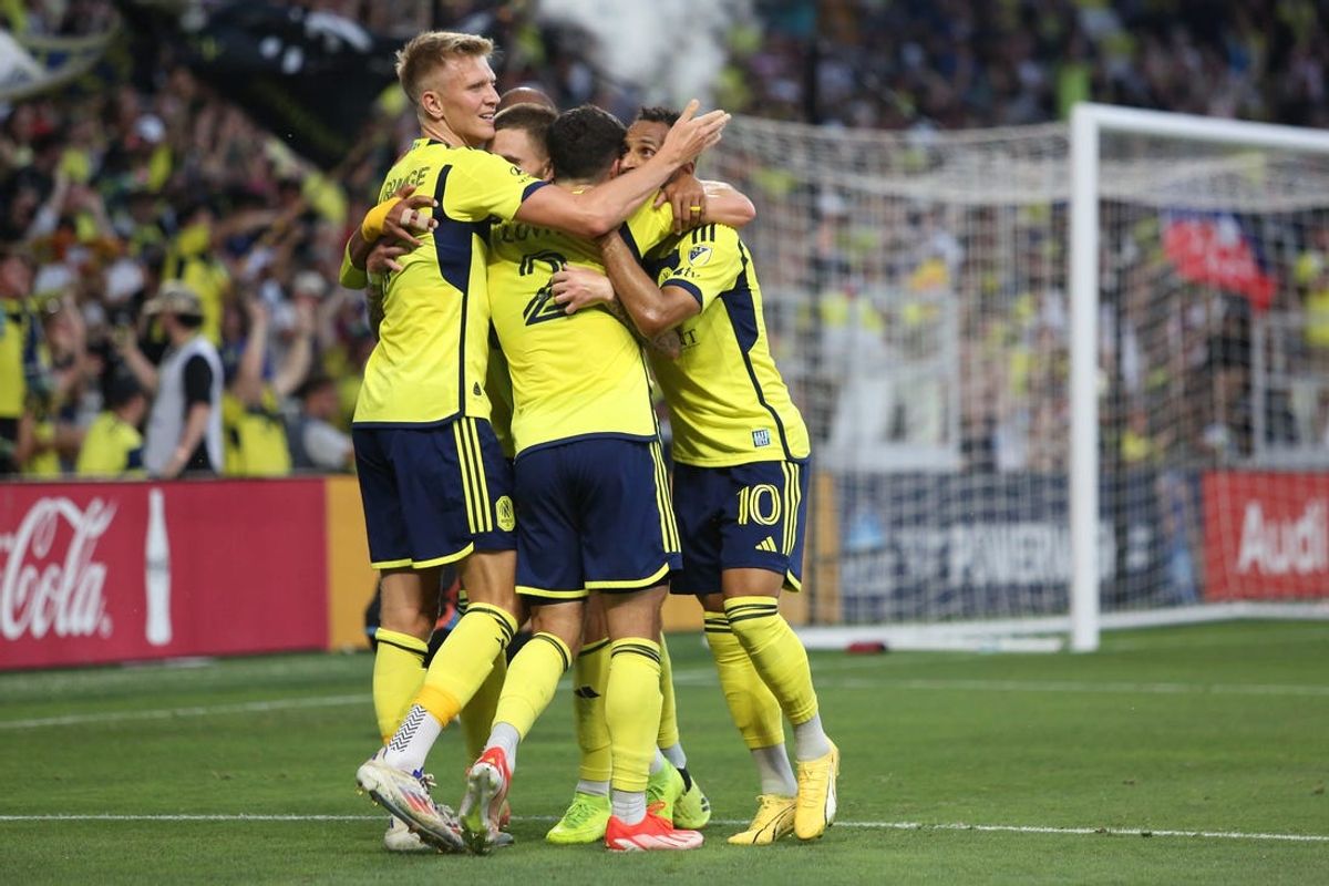 Jun 22, 2024; Nashville, Tennessee, USA; Nashville SC forward Tyler Boyd (11) and teammates celebrate after scoring a goal against New York City FC during the first half at Geodis Park. Mandatory Credit: Kindell Buchanan-USA TODAY Sports