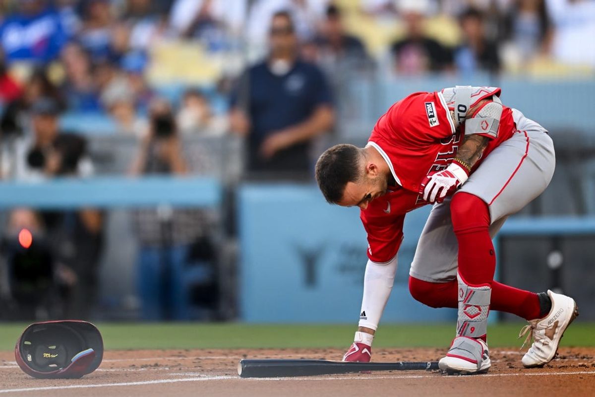 Jun 22, 2024; Los Angeles, California, USA; Los Angeles Angels shortstop Zach Neto (9) reacts after suffering an apparent injury during the second inning against the Los Angeles Dodgers at Dodger Stadium. Mandatory Credit: Jonathan Hui-USA TODAY Sports