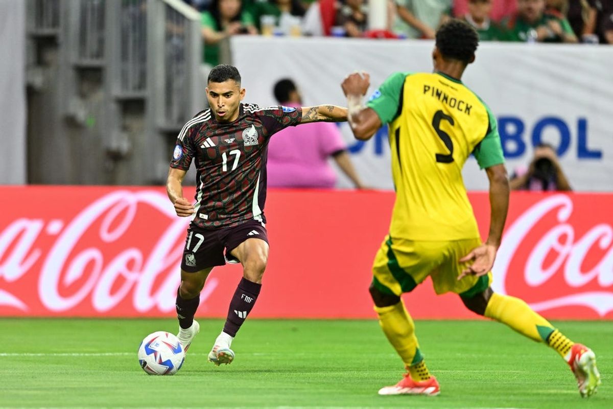 Jun 22, 2024; Houston, TX, USA; Mexico midfielder Orbelin Pineda (17) kicks the ball as Jamaica defender Ethan Pinnock (5) defends during the first half at NRG Stadium. Mandatory Credit: Maria Lysaker-USA TODAY Sports