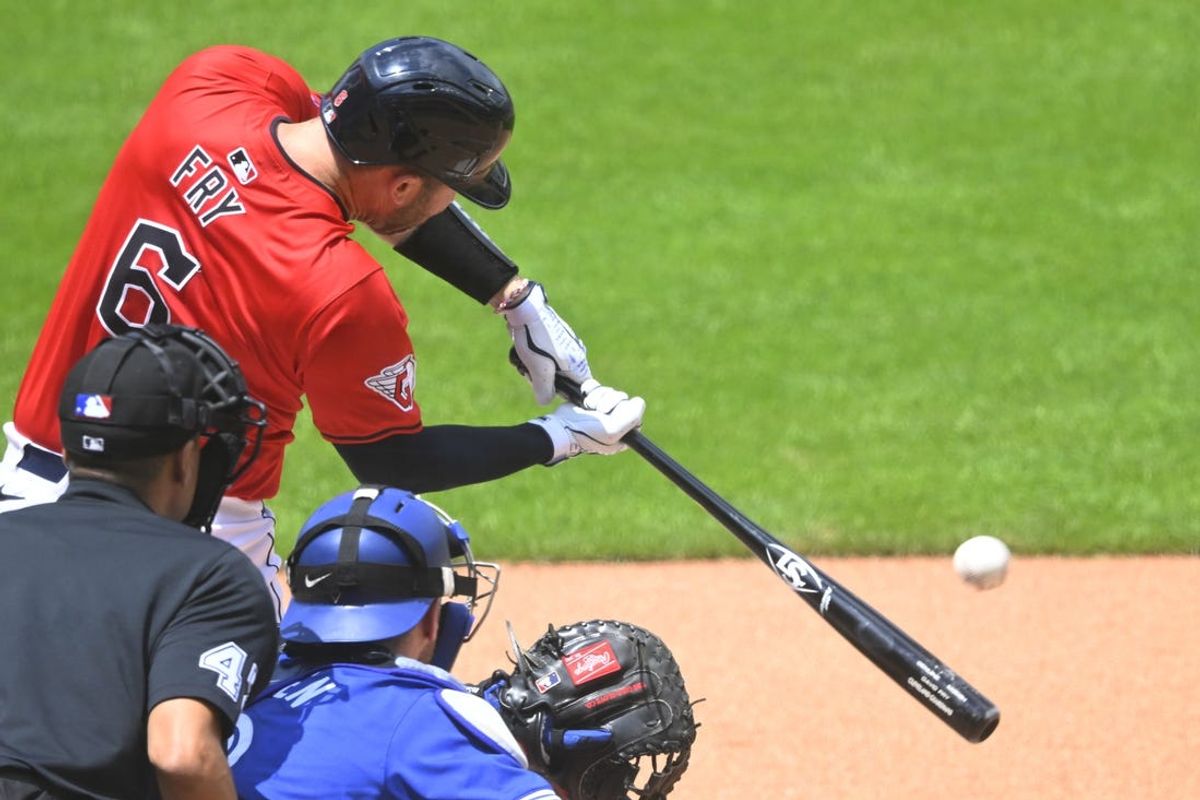 Jun 23, 2024; Cleveland, Ohio, USA; Cleveland Guardians catcher David Fry (6) hits a RBI single in the first inning against the Toronto Blue Jays at Progressive Field. Mandatory Credit: David Richard-USA TODAY Sports