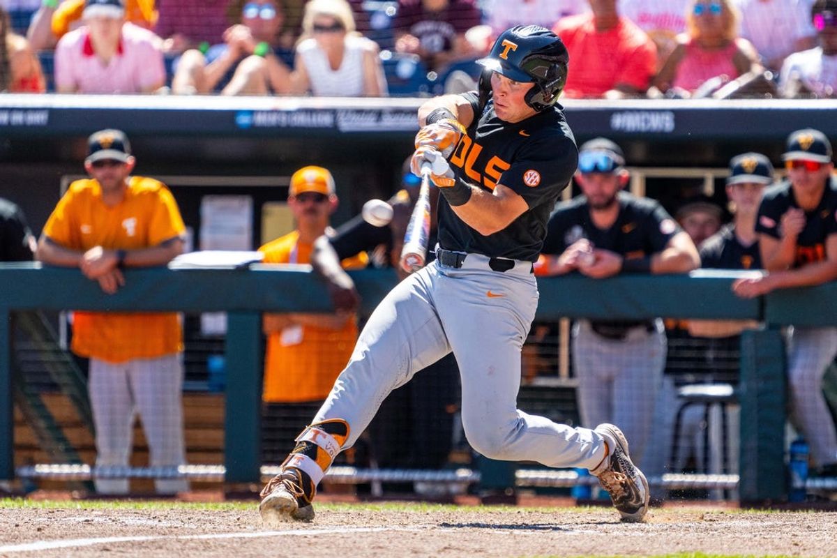 Jun 23, 2024; Omaha, NE, USA; Tennessee Volunteers left fielder Dylan Dreiling (8) hits a two-run home run against the Texas A&M Aggies during the seventh inning at Charles Schwab Field Omaha. Mandatory Credit: Dylan Widger-USA TODAY Sports