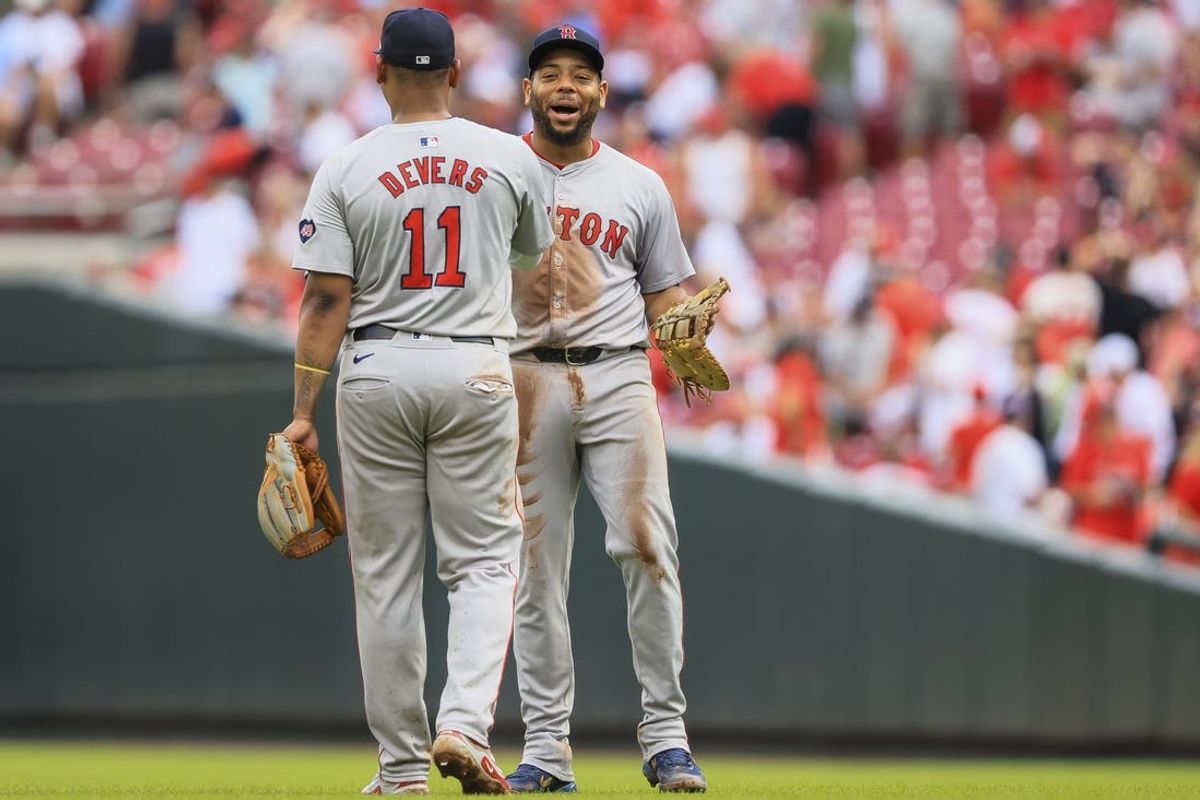 Jun 23, 2024; Cincinnati, Ohio, USA; Boston Red Sox first baseman Dominic Smith (2) reacts with third baseman Rafael Devers (11) after the victory over the Cincinnati Reds at Great American Ball Park. Mandatory Credit: Katie Stratman-USA TODAY Sports