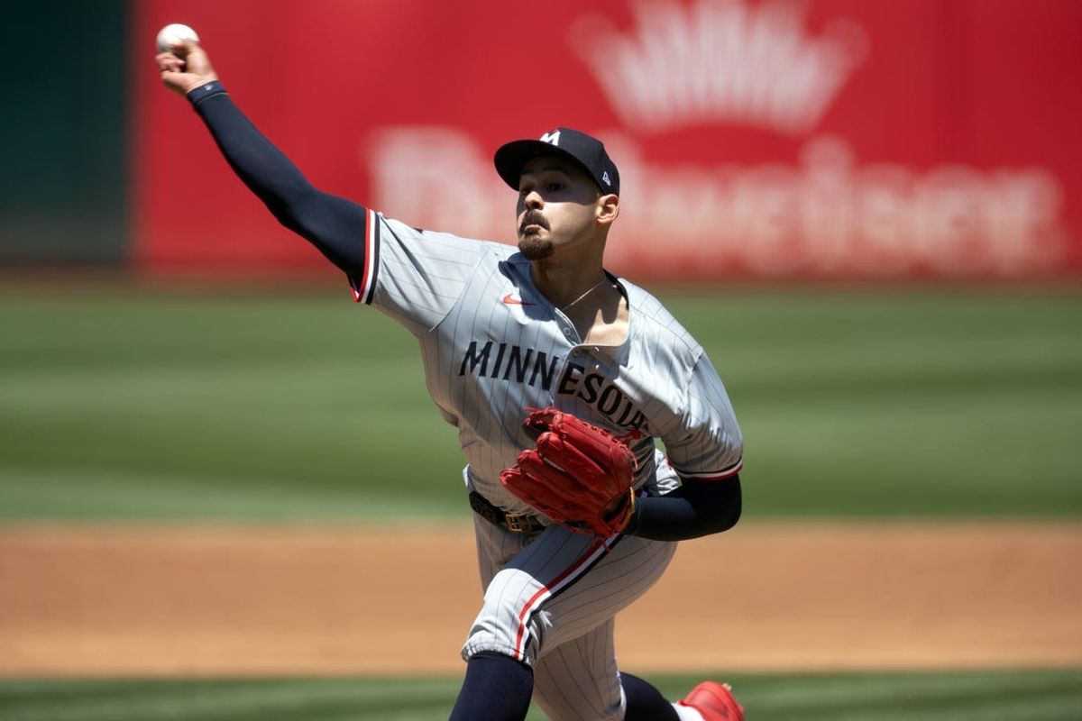 Jun 23, 2024; Oakland, California, USA; Minnesota Twins starting pitcher Pablo Lopez (49) delivers a pitch against the Oakland Athletics during the second inning at Oakland-Alameda County Coliseum. Mandatory Credit: D. Ross Cameron-USA TODAY Sports