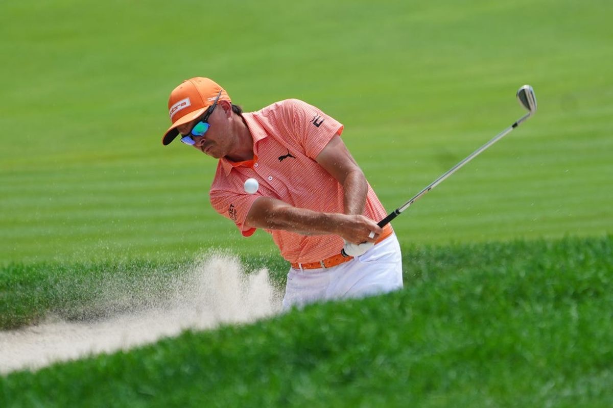 Jun 23, 2024; Cromwell, Connecticut, USA; Rickie Fowler chips on the eighteenth hole during the final round of the Travelers Championship golf tournament at TPC River Highlands. Mandatory Credit: Gregory Fisher-USA TODAY Sports