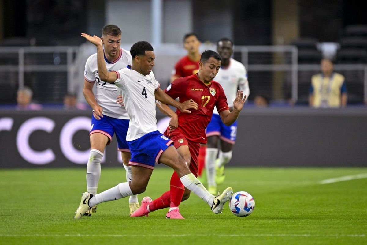 Jun 23, 2024; Arlington, TX, USA; United States midfielder Tyler Adams (4) knocks the ball away from Bolivia midfielder Miguel Terceros (7) during the first half in a 2024 Copa America match at AT&T Stadium. Mandatory Credit: Jerome Miron-USA TODAY Sports