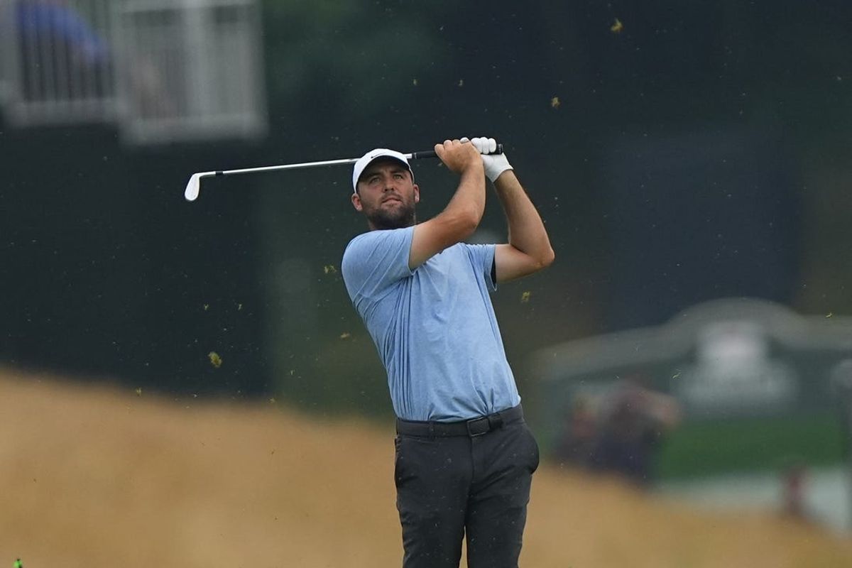 Jun 23, 2024; Cromwell, Connecticut, USA; Scottie Scheffler hits the ball from the fairway during the playoff round of the Travelers Championship golf tournament at TPC River Highlands. Mandatory Credit: Gregory Fisher-USA TODAY Sports