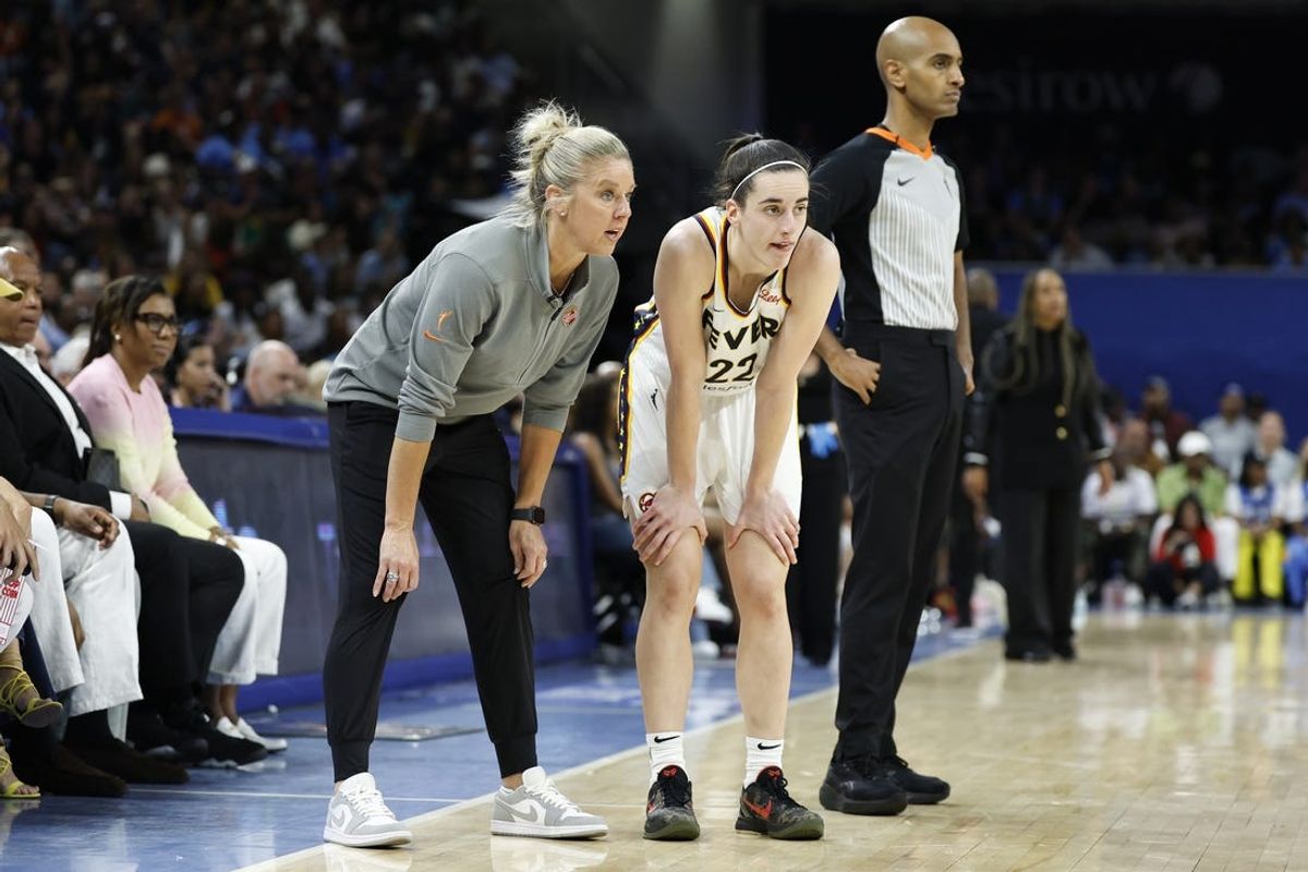 Jun 23, 2024; Chicago, Illinois, USA; Indiana Fever head coach Christie Sides talks with guard Caitlin Clark (22) during the second half of a basketball game against the Chicago Sky at Wintrust Arena. Mandatory Credit: Kamil Krzaczynski-USA TODAY Sports
