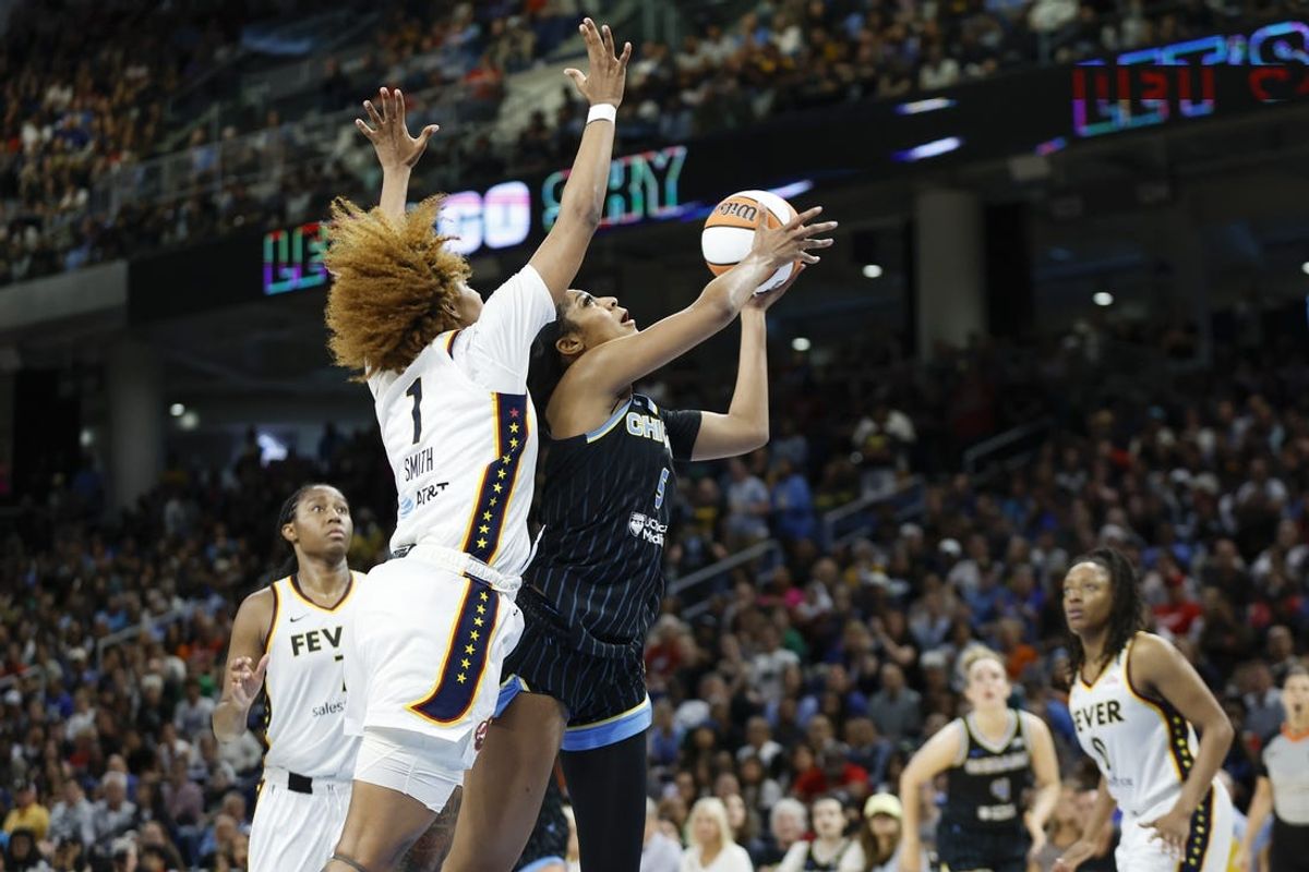 Jun 23, 2024; Chicago, Illinois, USA; Chicago Sky forward Angel Reese (5) goes to the basket against Indiana Fever forward NaLyssa Smith (1) during the second half of a basketball game at Wintrust Arena. Mandatory Credit: Kamil Krzaczynski-USA TODAY Sports