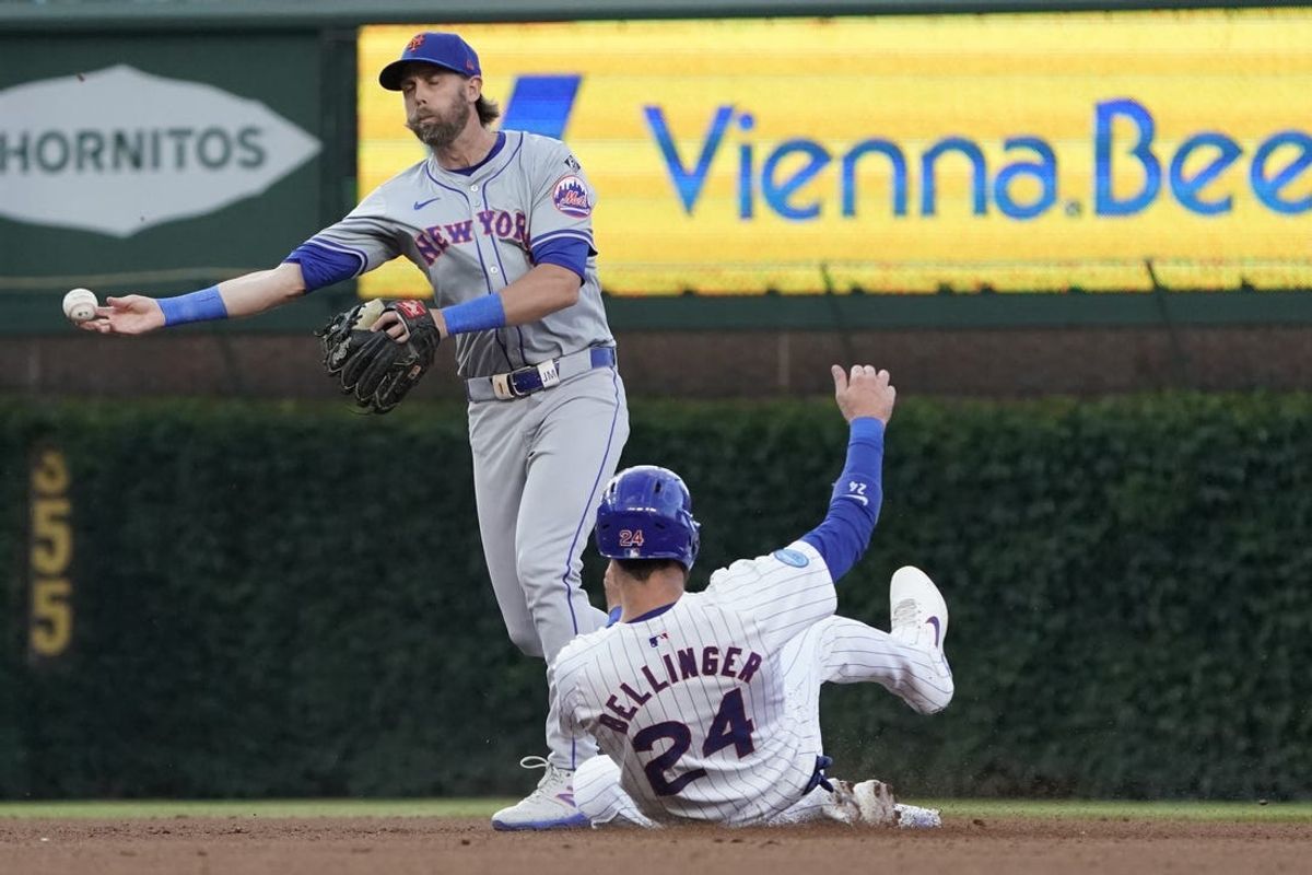 Jun 23, 2024; Chicago, Illinois, USA; New York Mets second baseman Jeff McNeil (1) forces out Chicago Cubs outfielder Cody Bellinger (24) at second base during the fifth inning at Wrigley Field. Mandatory Credit: David Banks-USA TODAY Sports