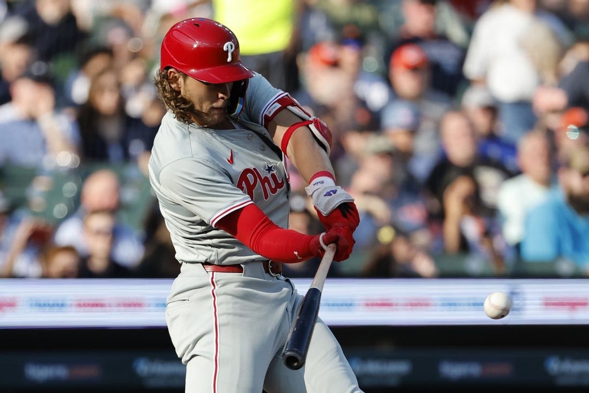Jun 24, 2024; Detroit, Michigan, USA;  Philadelphia Phillies third baseman Alec Bohm (28) hits a two-run home run in the first inning against the Detroit Tigers at Comerica Park. Mandatory Credit: Rick Osentoski-USA TODAY Sports