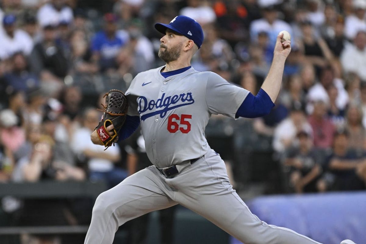 Jun 24, 2024; Chicago, Illinois, USA;  Los Angeles Dodgers hitting coach Aaron Bates (65) delivers against the Chicago White Sox in the first inning at Guaranteed Rate Field. Mandatory Credit: Matt Marton-USA TODAY Sports